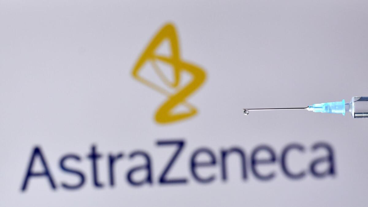 An illustration picture shows a drop from a syringe with the logo of British pharmaceutical company AstraZeneca on November 17, 2020. (Photo: AFP)