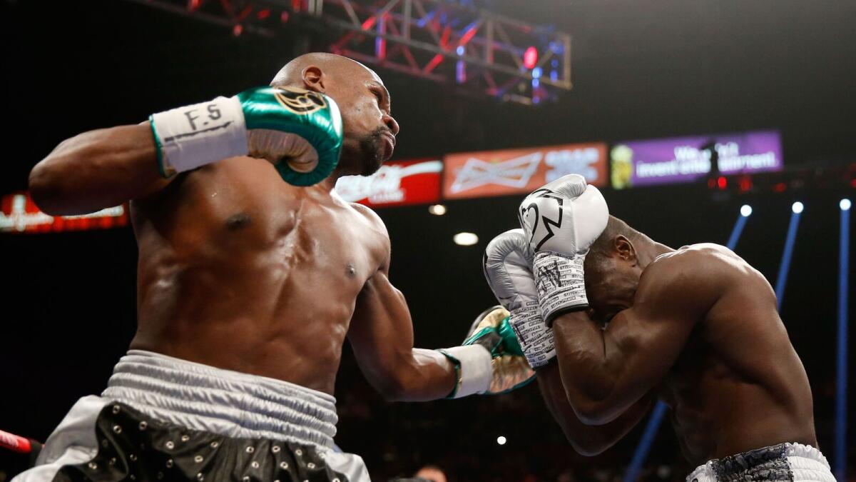 Floyd Mayweather Jr. throws a punch at Andre Berto during their WBC/WBA welterweight title fight. 
