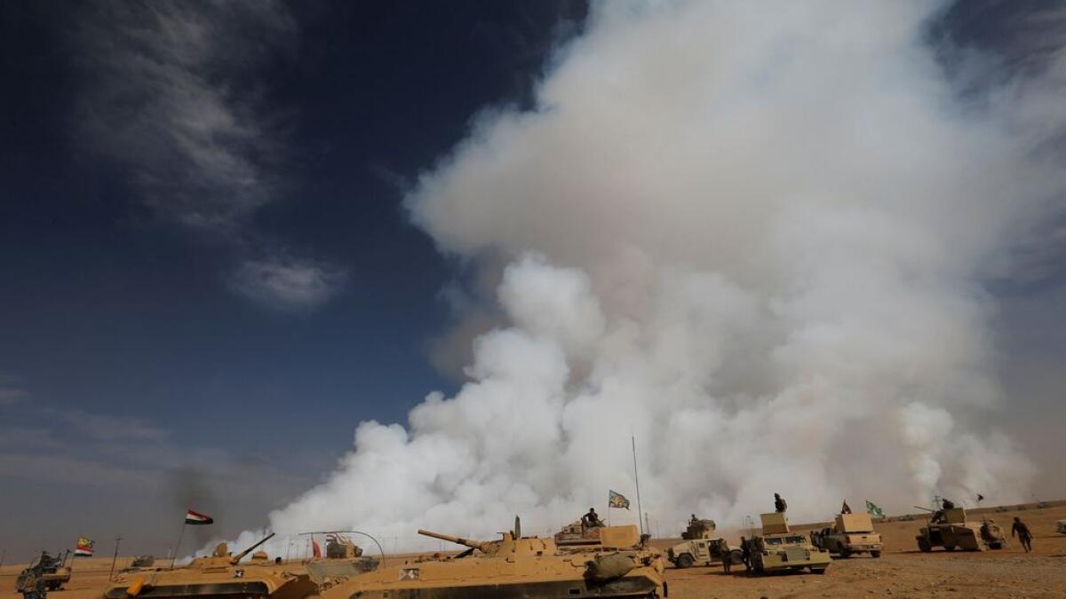Burning sulphur near Mosul sends hundreds to hospital, U.S. troops don masks