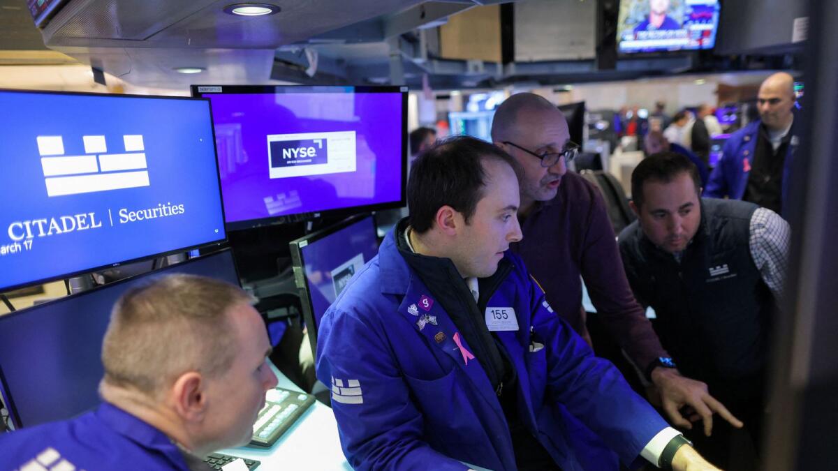 Traders at the New York Stock Exchange on Friday. - Reuters