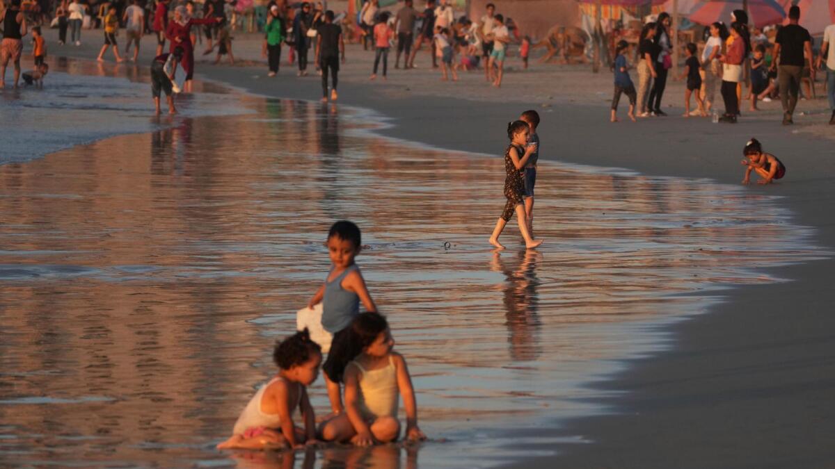 Palestinians spend time at the beach along the Mediterranean Sea in Gaza City. — AP file