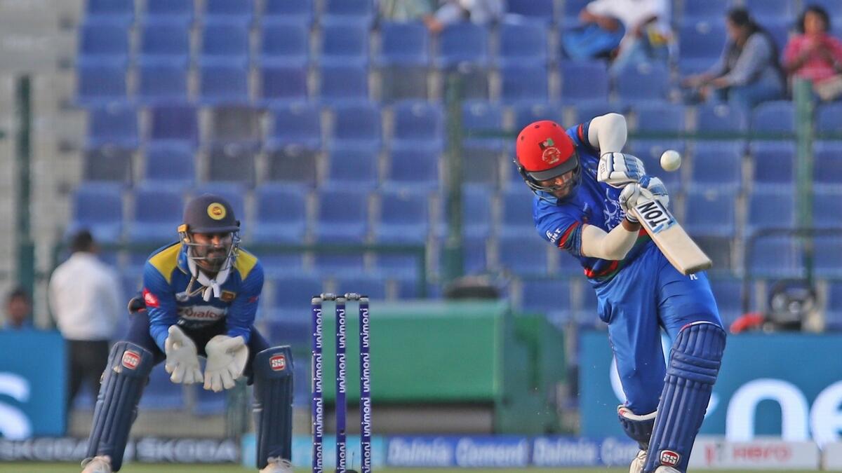 Afghanistan batsman Rahmat Shah plays a shot during the one day international match against Sri Lanka in the Asia Cup at the Sheikh Zayed Stadium in Abu Dhabi.- Photo by Ryan Lim