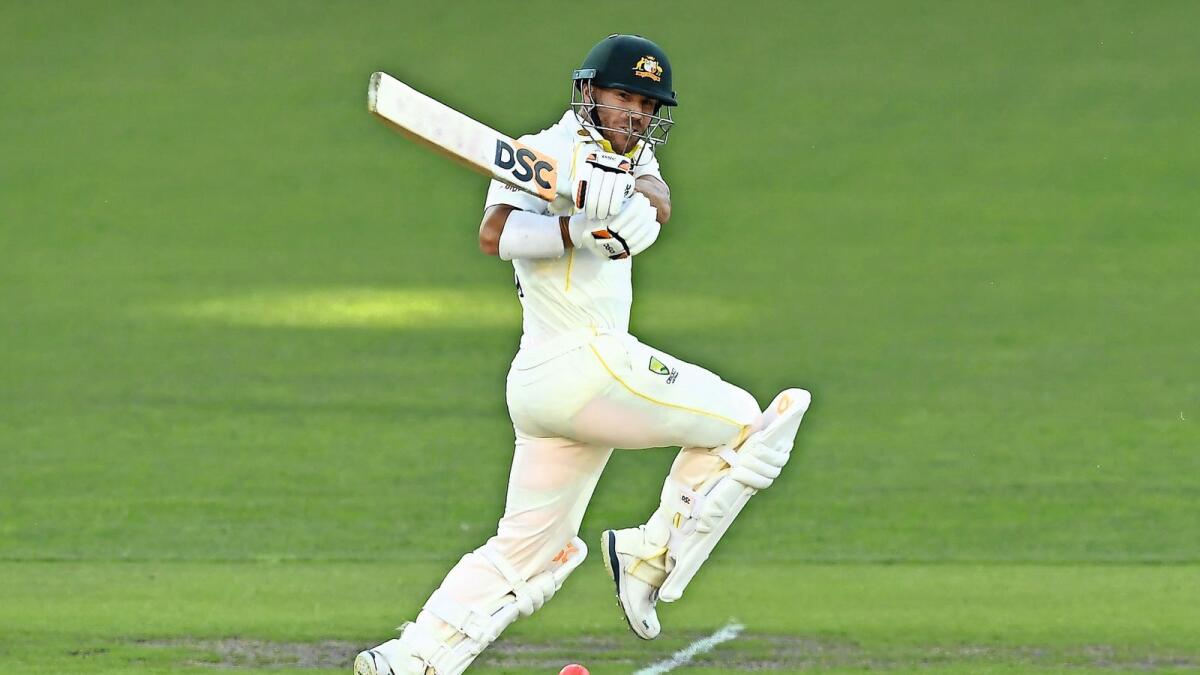 Australia's David Warner plays a shot on day one of the second Ashes Test against England in Adelaide on Thursday. — AFP