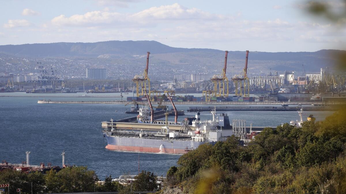An oil tanker is moored at the Sheskharis complex, in Novorossiysk, Russia. The G7 cap  on Russia's oil sales comes into effect from Monday. - AP file)