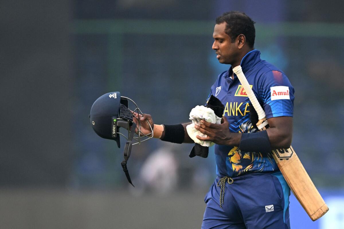 Sri Lanka's Angelo Mathews walks back to the pavilion after the controversial dismissal. — AFP