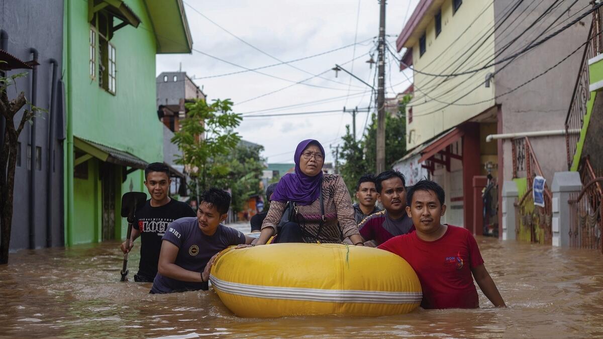 Overflowing dam kills at least 30 in Indonesia