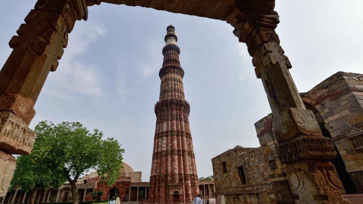 People visit Qutub Minar after it re-opened for public, during Unlock 2.0, in New Delhi, India. Photo: PTI