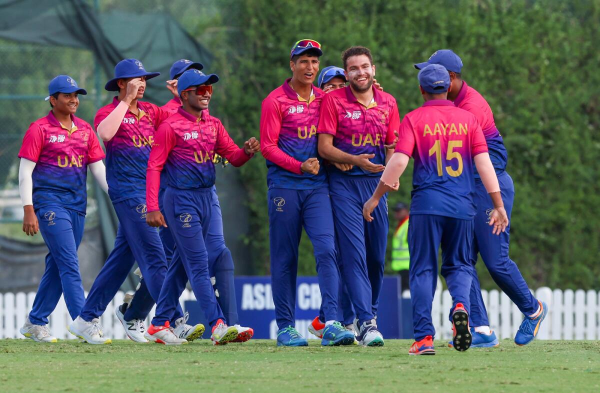Skipper Aayan (right) celebrates a wicket against Pakistan with his teammates. — X
