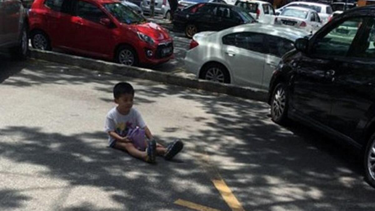 3-year-old left alone by mother to reserve parking spot on a hot day 