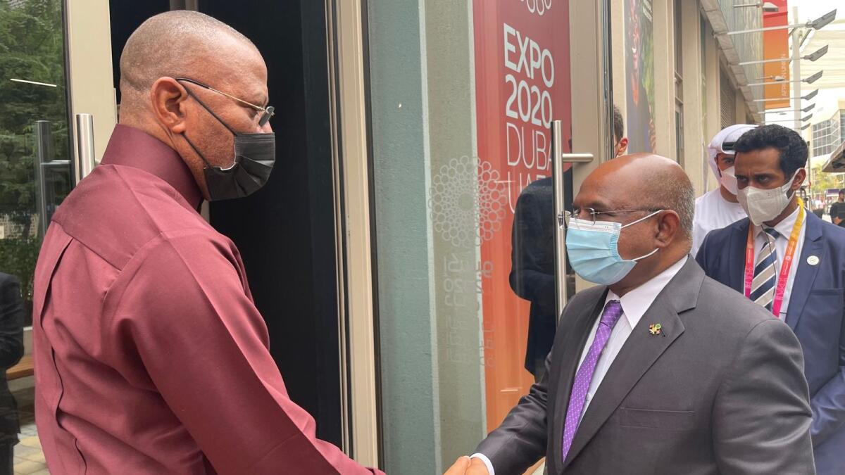 Abdulla Shahid, President of the UNGA (right), is welcomed into the African Union pavilion by AU Commissioner-General Dr Levy Uche Madueke