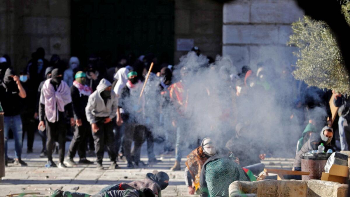 Palestinian demonstrators clash with Israeli police at Jerusalem's Al Aqsa Mosque compound. — AFP