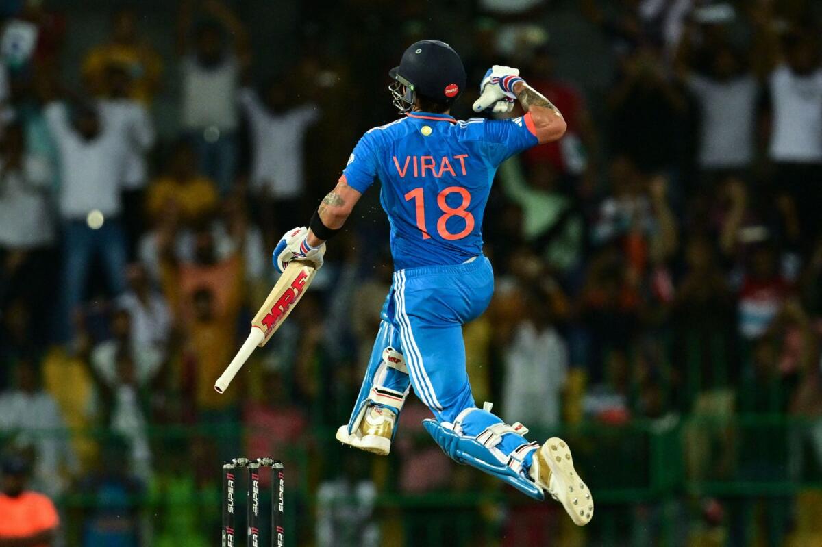 India's Virat Kohli celebrates after scoring a century during the Asia Cup match against Pakistan. — AFP