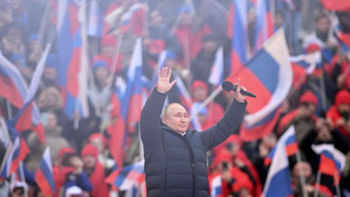 Russian President Vladimir Putin waves during a concert marking the eighth anniversary of Russia's annexation of Crimea at Luzhniki Stadium in Moscow. — Reuters