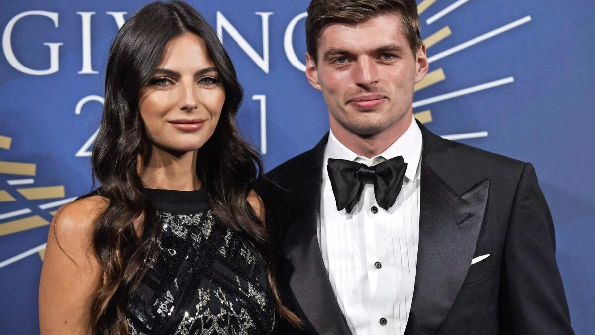 Red Bull's Max Verstappen (right) and his partner Brazilian model Kelly Piquet pose on the blue carpet ahead of the FIA Prize Giving 2021 gala in Paris on Thursday. — AFP