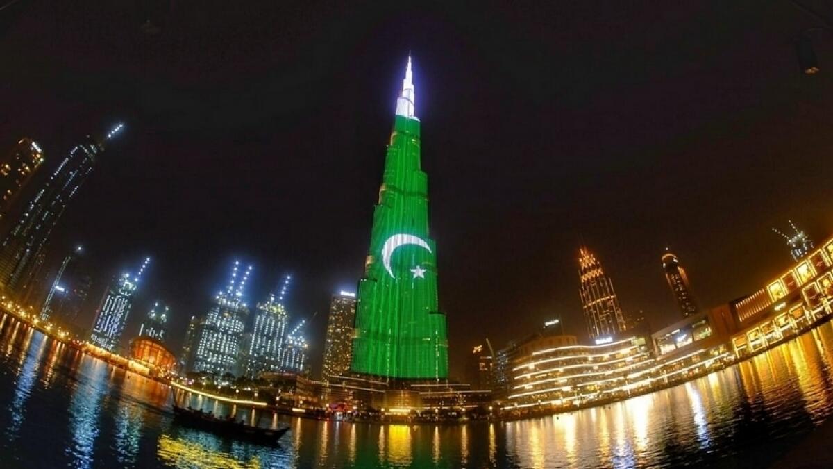 upside down flag, pakistan, flag orientation, burj khalifa, dubai, independence day, light show, pakistanis, expats