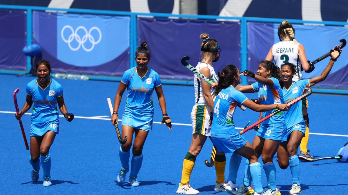 Neha Goyal of India celebrates her goal with teammates. — Reuters