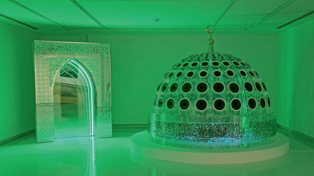 MIRHAB, a piece by Khalid Zahid and Ali Chaaban of Saudi Arabia and Lebanon, paints a room green.-  Photo by M. Sajjad