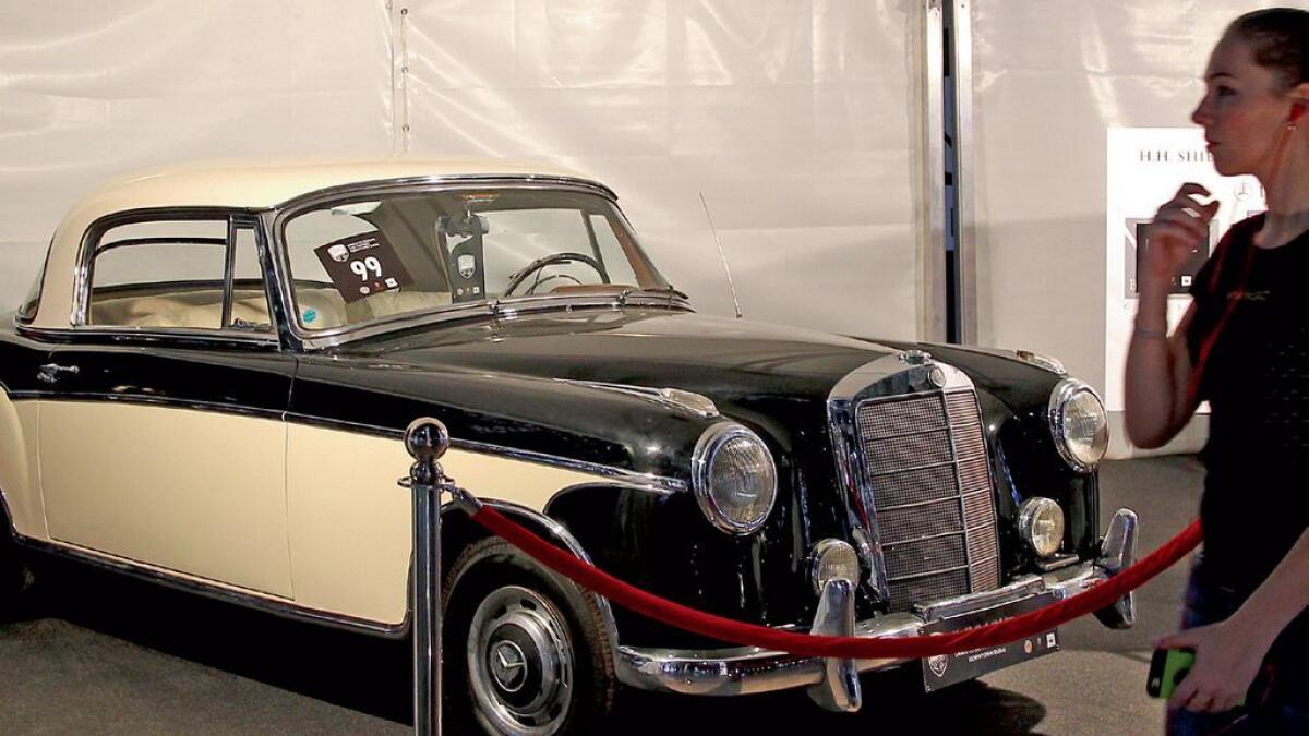 HISTORY AND LEGACY ... A visitor admires a 1957 Mercedes that was the personal vehicle of the late Shaikh Zayed bin Sultan Al Nahyan, the founding father of the UAE.