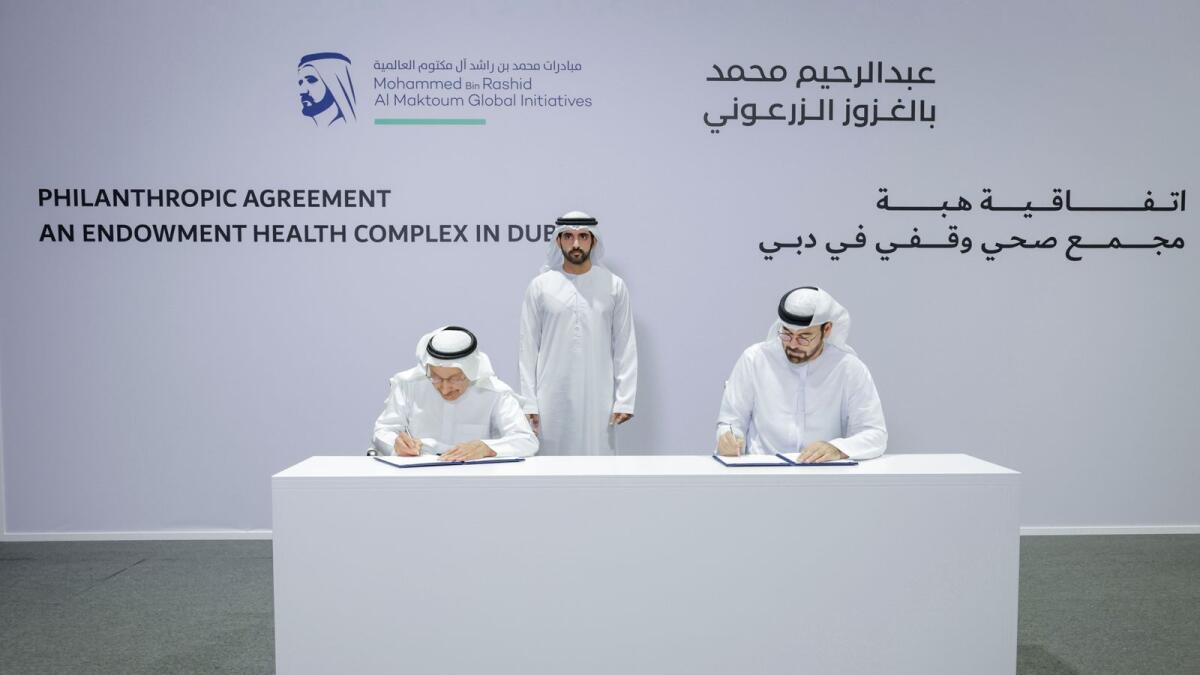 Sheikh Hamdan witnesses an agreement signing by Mohammad Al Gergawi and Abdul Rahim Al Zarooni in Dubai. — Supplied photo