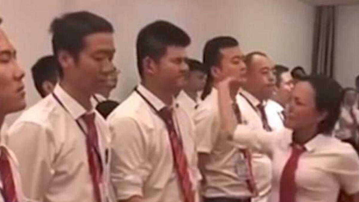 Video: Chinese staff beg to be slapped for not working hard