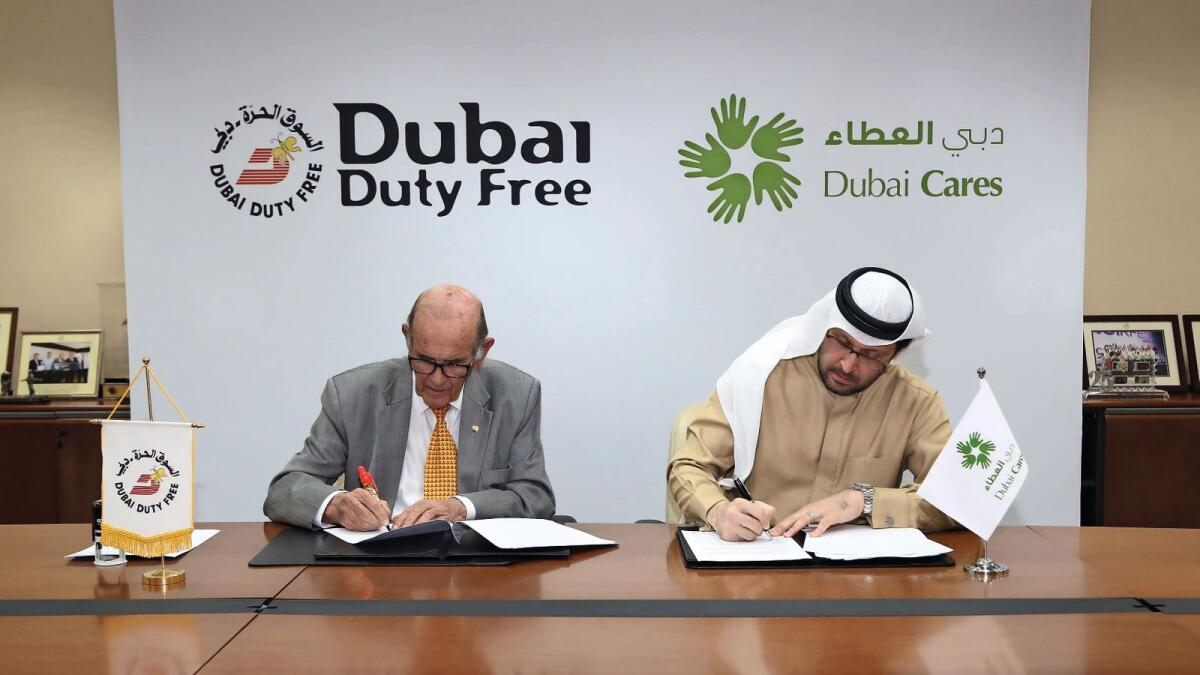 Colm McLoughlin, Executive Vice Chairman &amp; CEO, DDF and Dr. Tariq Al Gurg, CEO and Vice-Chairman, Dubai Cares, signing the Memorandum of Understanding (MoU) at the DDF Head Office in Ramool.