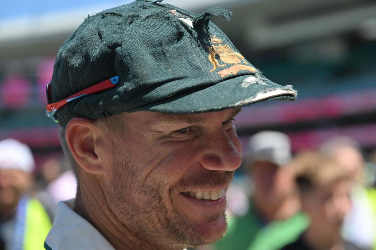 Australia's David Warner with his iconic baggy green cap. - AFP