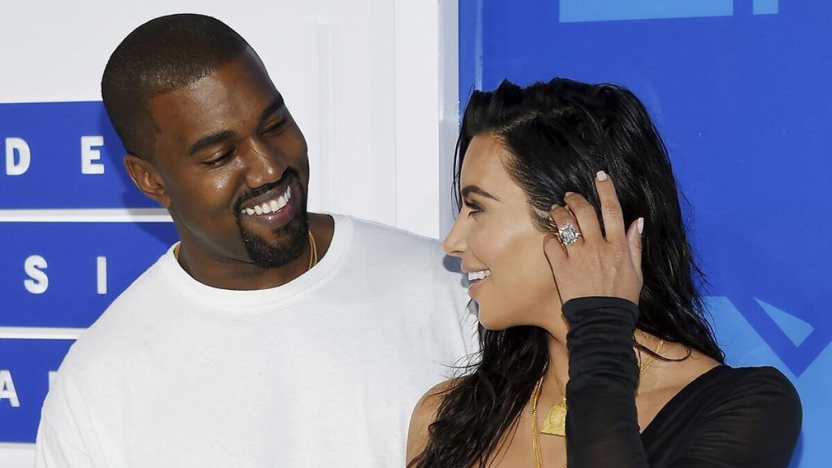 Kanye West, left, and Kim Kardashian West 