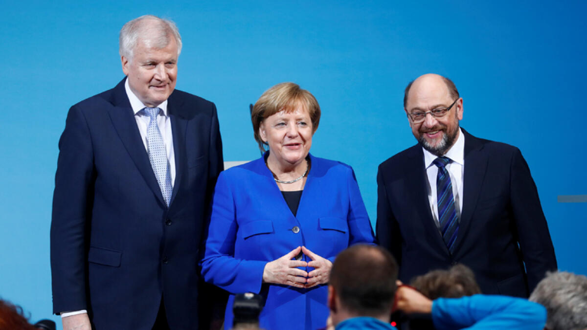 Merkel strikes deal with SDP, opening way to new govt