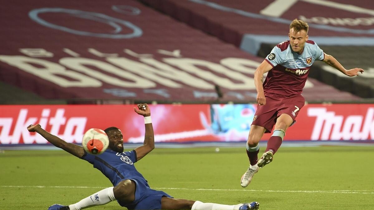 West Ham's Andriy Yarmolenko, right shoots and scores this sides third goal past Chelsea's Antonio Rudiger during the English Premier League match against Chelsea
