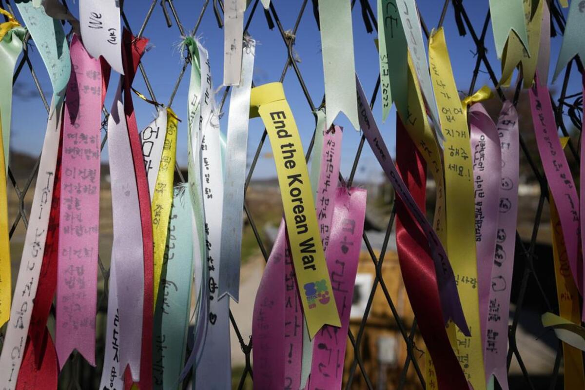 Ribbons with messages wishing for the peace of the two Koreas hang on the wire fences at the Imjingak Pavilion in Paju. Photo: AP
