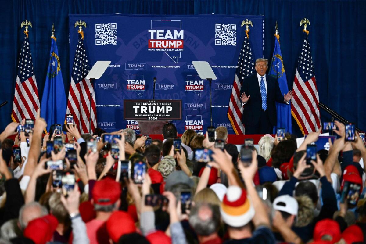 Former US president and 2024 presidential hopeful Donald Trump gestures as he arrives to speak at a Commit to Caucus Rally in Las Vegas, Nevada, on January 27, 2024. — AFP