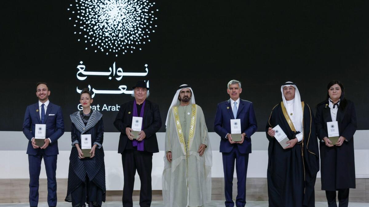Sheikh Mohammed with the winners of Great Arab Minds awards in Dubai. — Photo: Wam