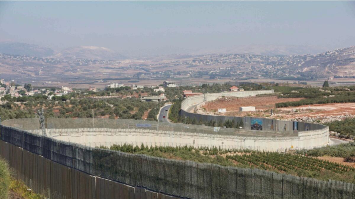 A view shows the border wall between Lebanon and Israel as pictured from Kfar Kila village, southern Lebanon. — Reuters