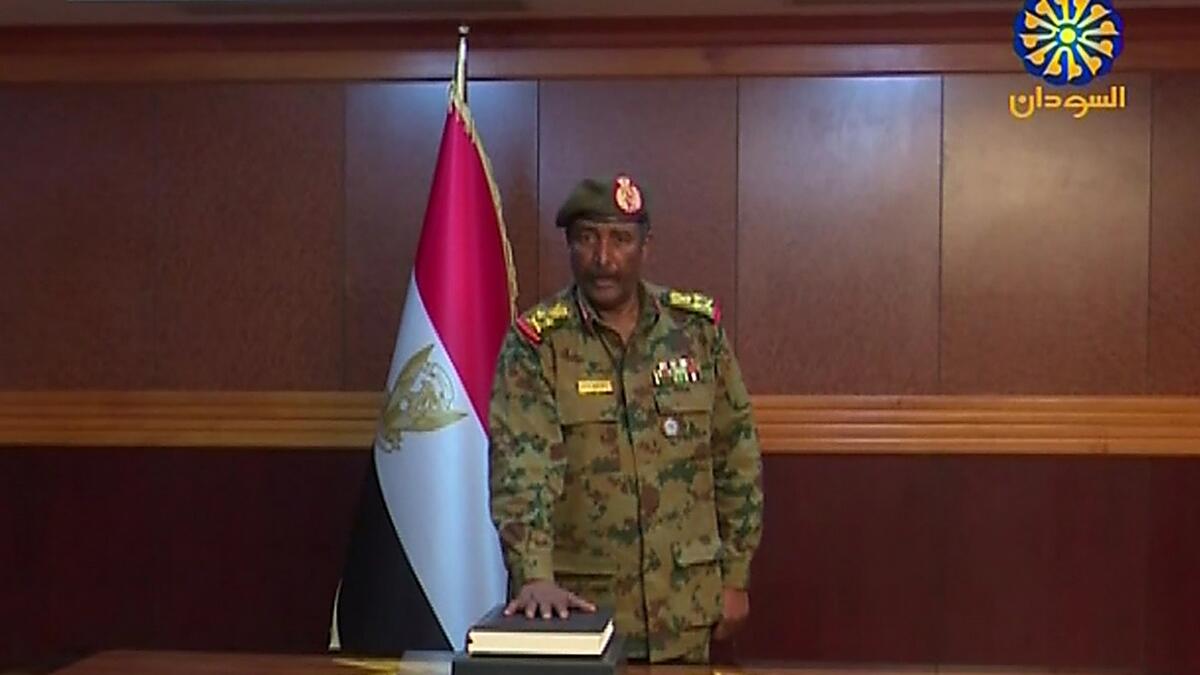 A grab from a broadcast on Sudan TV shows General Abdel Fattah al-Burhan Abdulrahman taking oath as chief of the new military council.- AFP