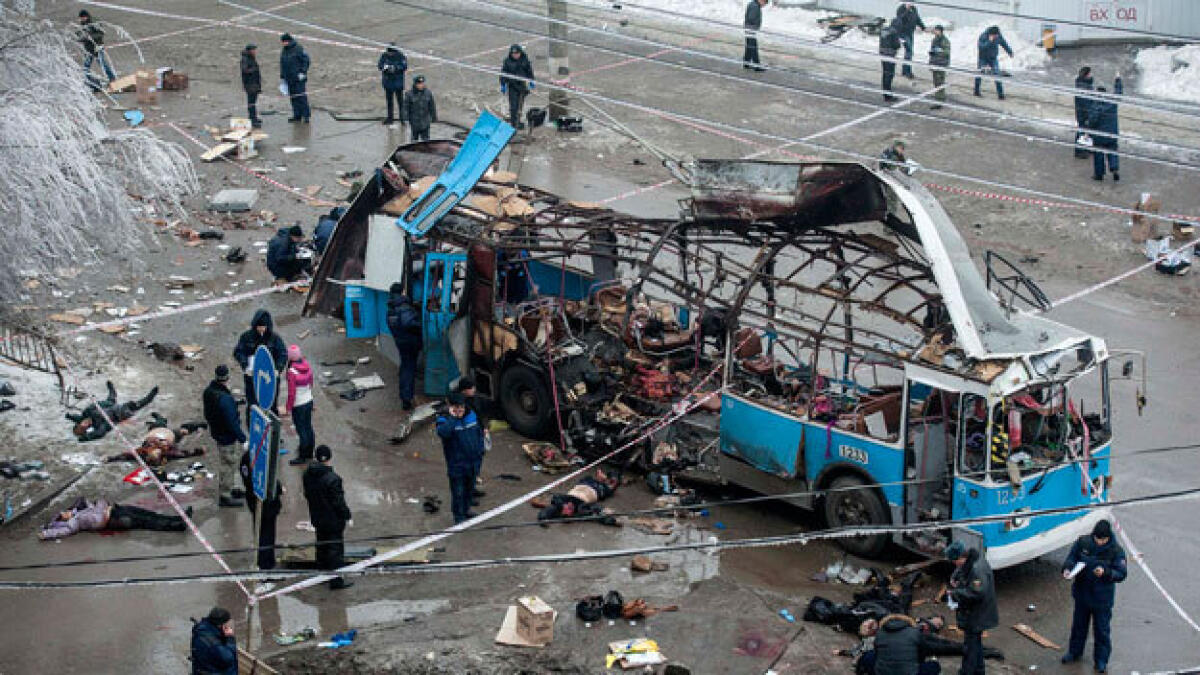 Russia buries dead as bombings toll hits 34