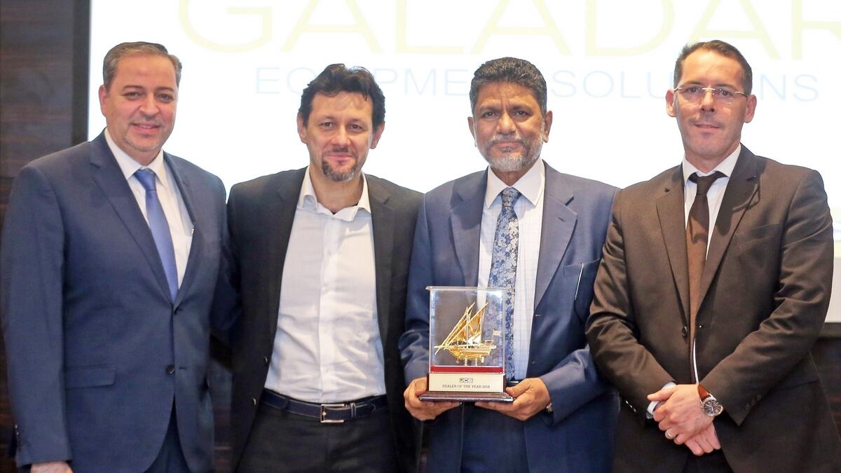 Ahmad Juma, national sales manager, GBES; Marco Bersellini, MD at JCB Sales, EMEAR; Mohamed Yahya Kazi Meeran, Director and Group CEO of Galadari Brothers; and Mazen Abdul Baki, GM, GBES; at the event. - Photo by Dhes Handumon