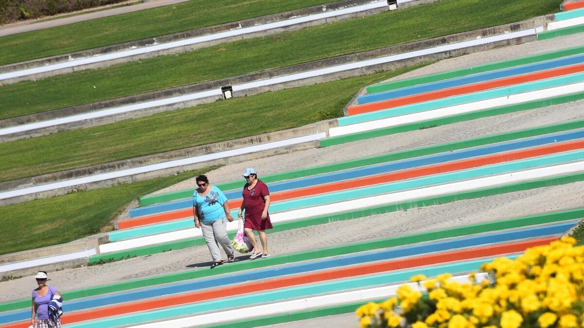 Visitors walk on the steps painted by Smart Paint.-Photo by Shihab