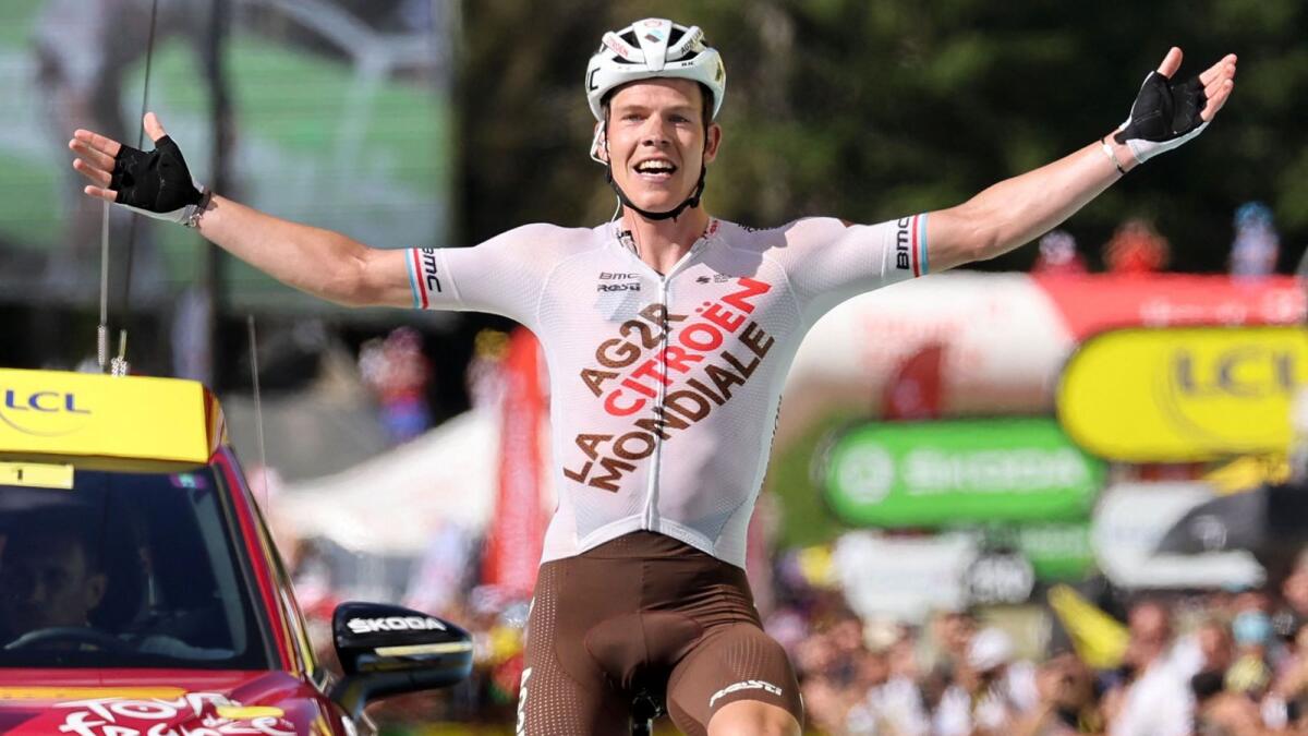 Bob Jungels celebrates as he cycles to the finish line. (AFP)