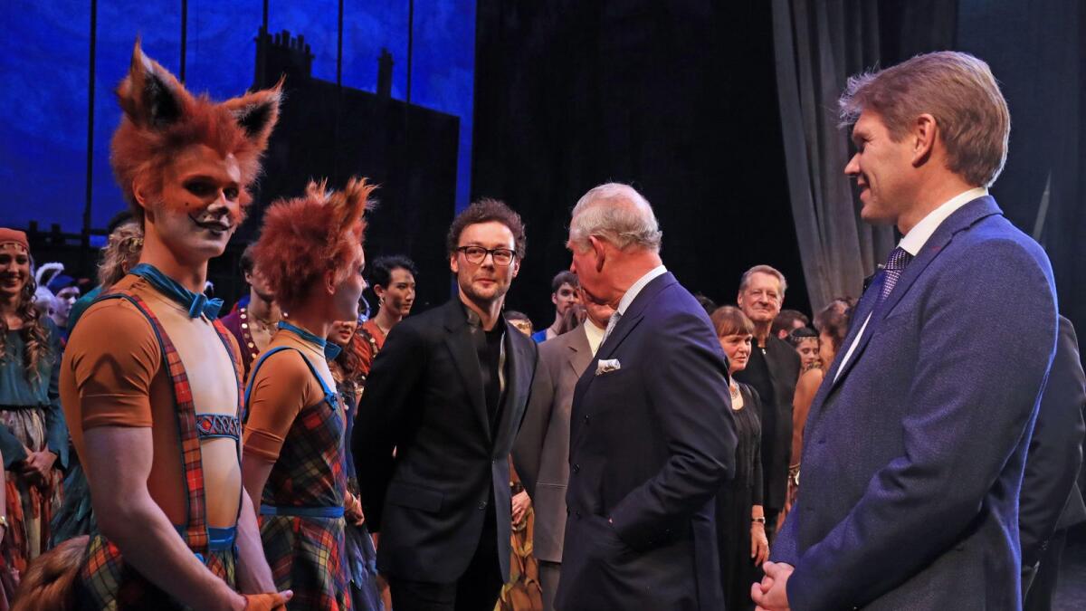 Prince Charles meets cast members and choreographer Liam Scarlett (centre) at the Royal Opera House, London. Photo: Alamy