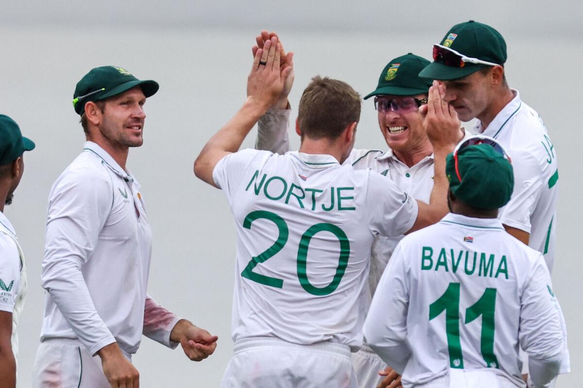 South Africa's Anrich Nortje (centre) celebrates with teammates after dismissing Australia's Marnus Labuschagne. — AFP