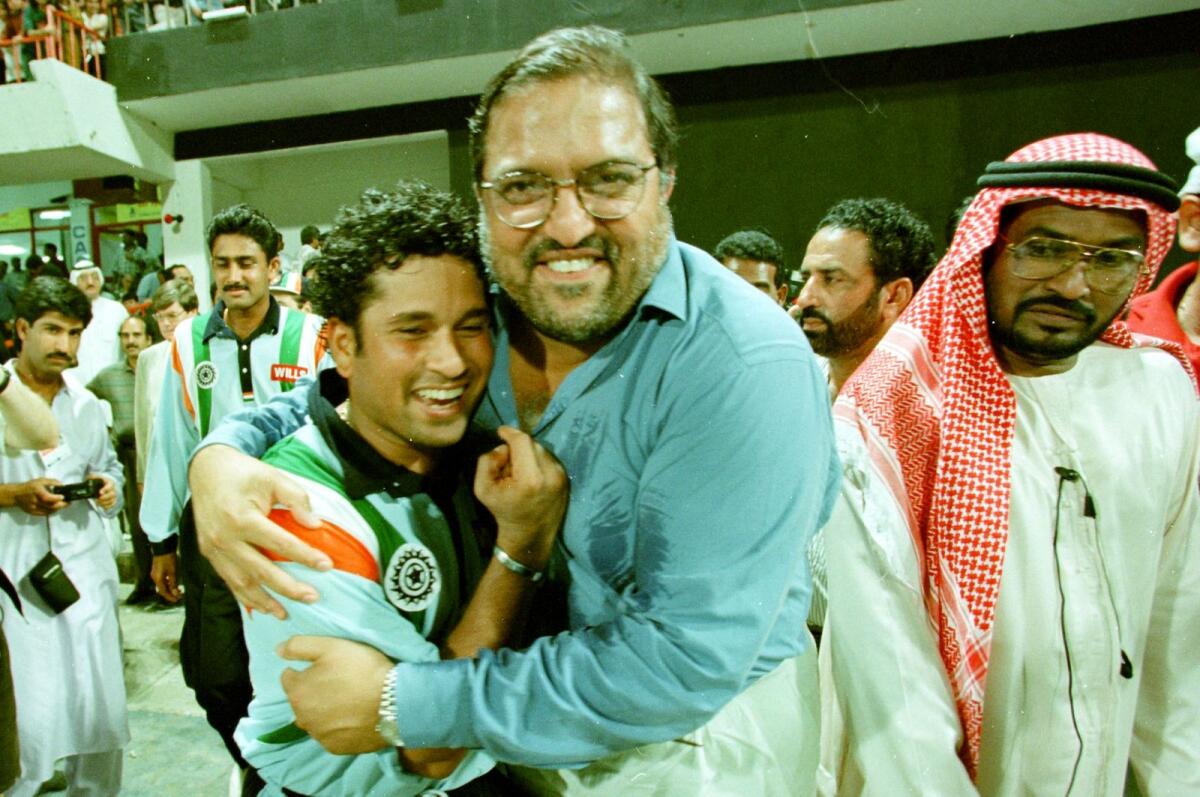 Sachin Tendulkar is congratulated by the late Mark Mascarenhas after his match-winning hundred in the final of the 1998 Coca Cola Cup against Australia in Sharjah. — AFP file