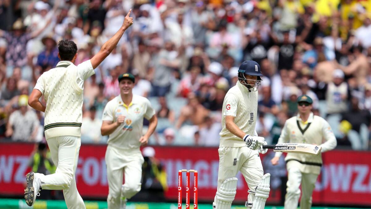 Australia's Mitchell Starc (left) celebrates the wicket of England's Joe Root. (AP)