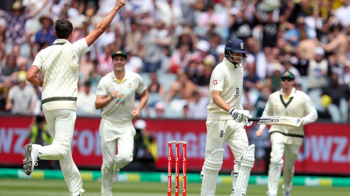 Australia's Mitchell Starc (left) celebrates the wicket of England's Joe Root. (AP)