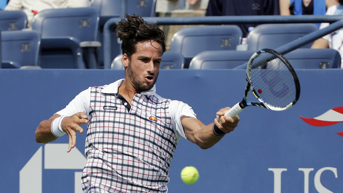 Feliciano Lopez returns a shot to Mardy Fish. — AP