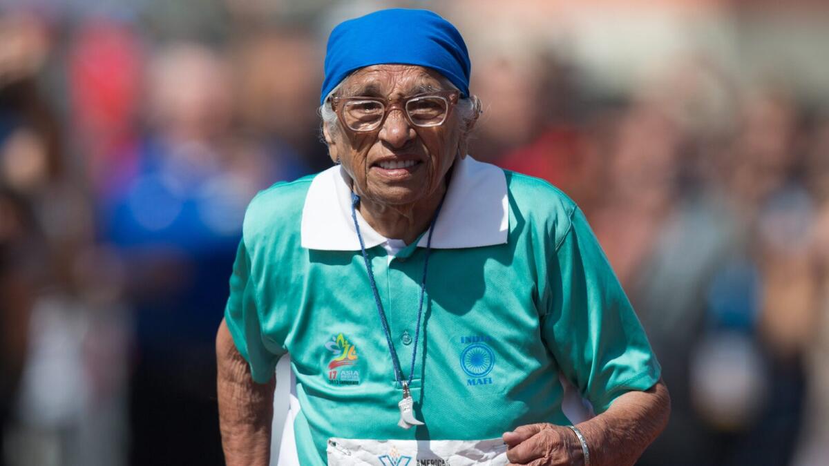 Man Kaur, 100, of India, competes in the 100-meter track and field event at the Americas Masters Games in Vancouver, British Columbia, Monday, Aug. 29, 2016. More than 10,000 athletes aged 30 and older are participating in the games which continue until Sept. 4. (Darryl Dyck/The Canadian Press via AP)