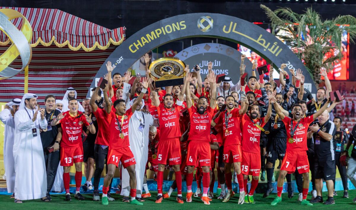 Shabab Al Ahli players celebrate with the trophy. — X