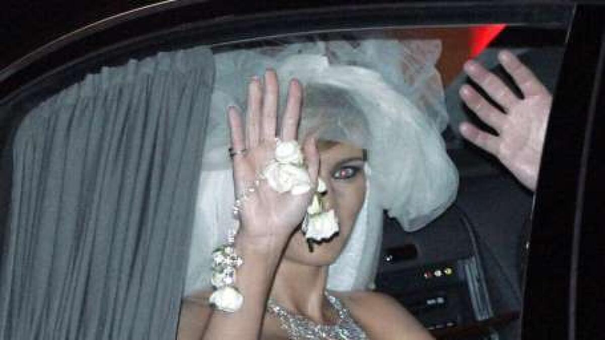 Donald Trump's new bride, Slovenian model Melania Knauss, waves as they leave the Bethesda-by-the-Sea Episcopal Church after their wedding in Palm Beach, Florida, January 22, 2005.