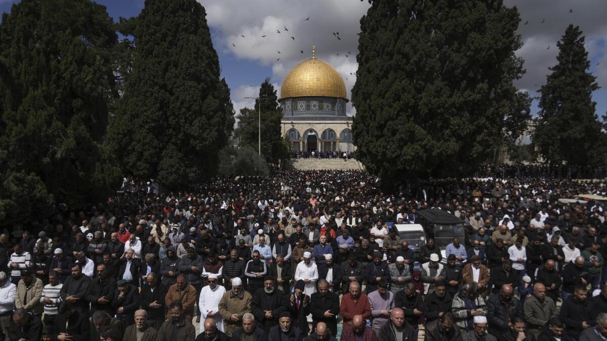 Worshippers perform Friday prayers at Al Aqsa Mosque compound in the Old City of Jerusalem. — AP