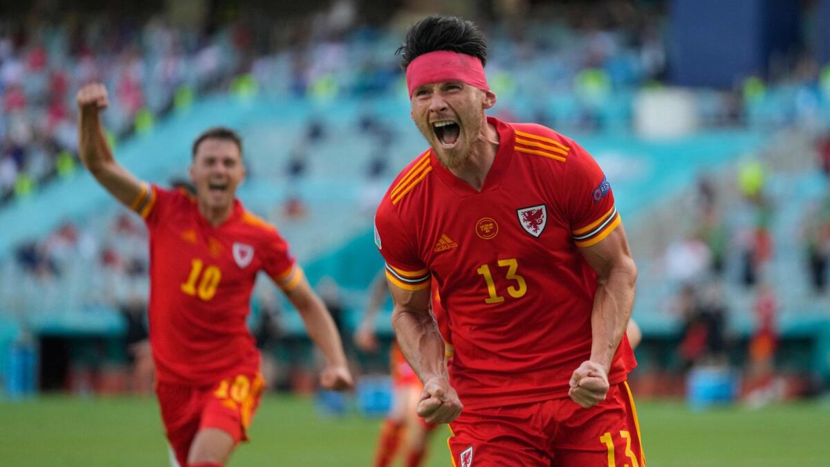 Wales' midfielder Kieffer Moore celebrates after scoring the equaliser during the Euro 2020 match against Switzerland. (AFP)