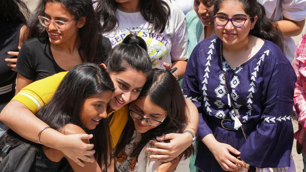 Students celebrate their success after the announcement of Grade 12 results by Central Board of Secondary Education (CBSE), in New Delhi on  Friday. — PTI